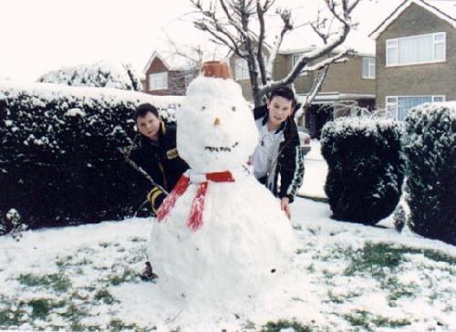 Boys make snowman